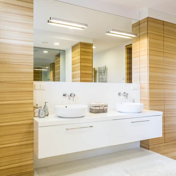 Wooden bathroom with mirror and sinks