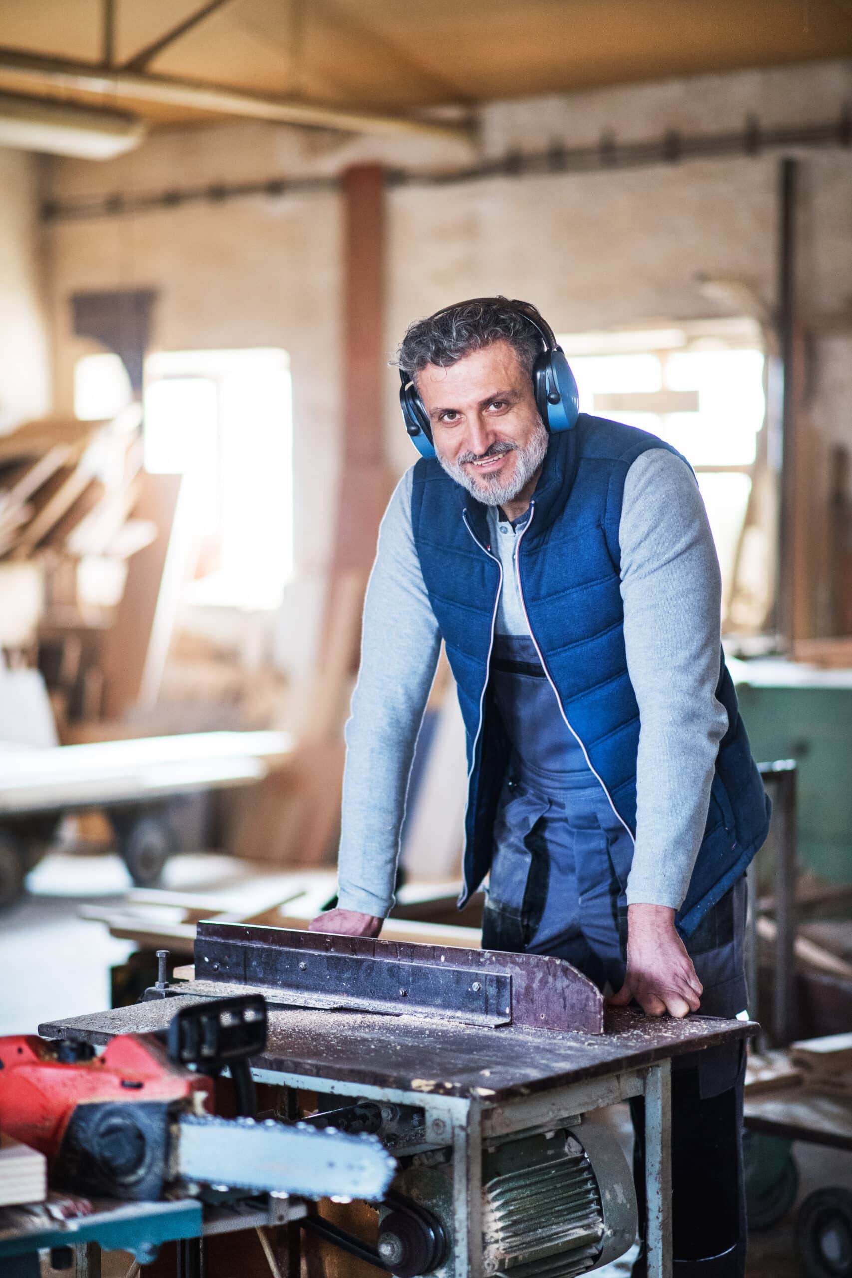 A man worker in the carpentry workshop 